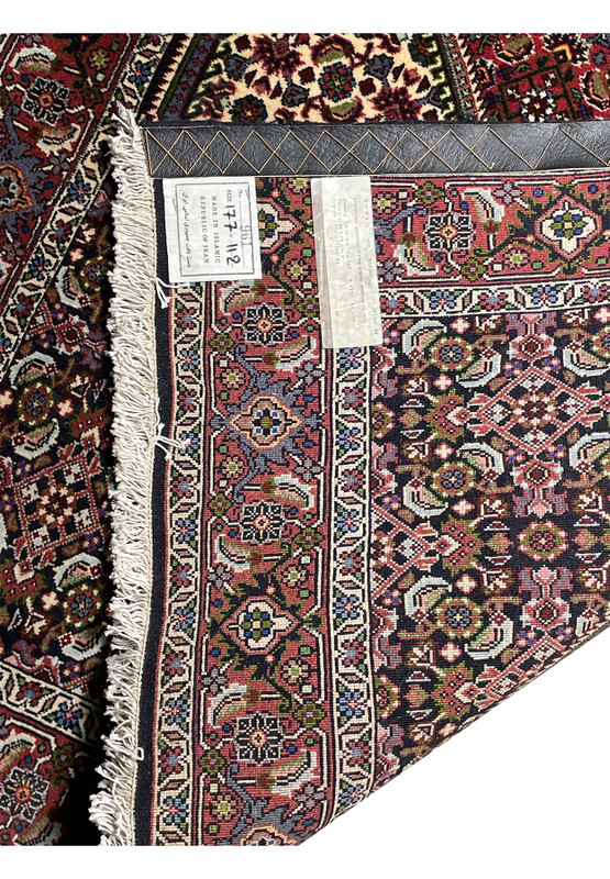 Backside Overview of a 4x6 Persian Bijar rug in a room setting, highlighting its vibrant colors and intricate quality.