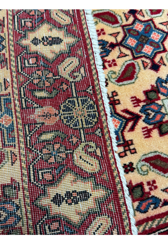 Back view of a 3'4 x 5'3 Persian Hamedan Rug, showcasing the craftsmanship and knotting technique.