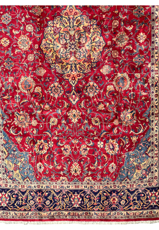 Lower border detail of the 9 x 13 Persian Sarough Rug with intricate floral and vine patterns in deep navy blue and ivory