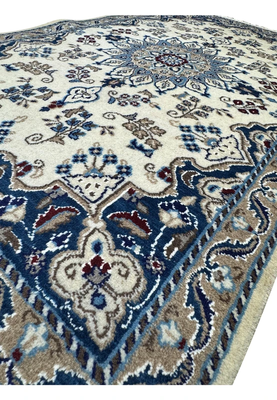 Angled view of a 2'10 x 4'8 Persian Nain Rug emphasizing the detailed design.