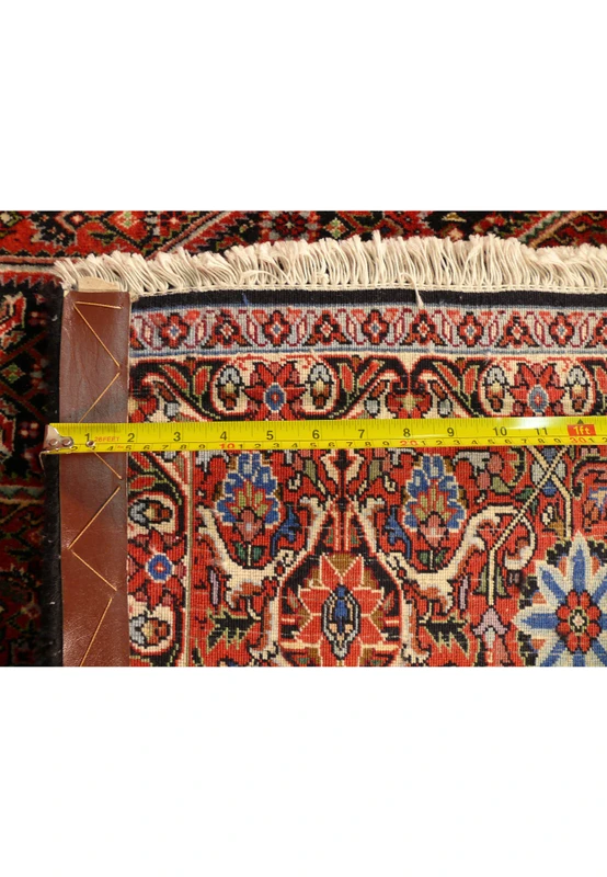 Zoomed into the back of this Bijar Persian Square rug with a ruler on it highlighting the high density of the knots.