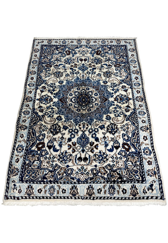 3 x 4'9 Nain Persian Rug laid down showcasing detailed design and vibrant colors.