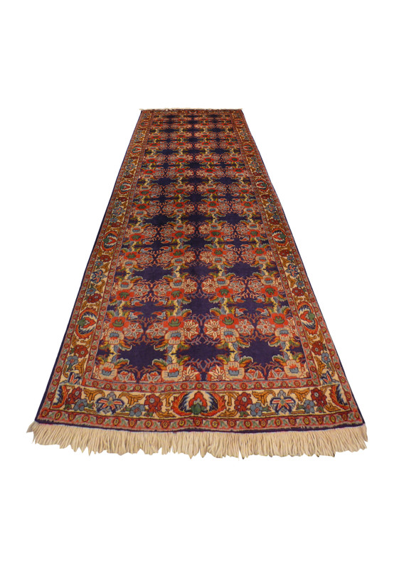 Laid down 2'6 x 7 Persian Bijar Runner highlighting detailed motifs and rich color palette.