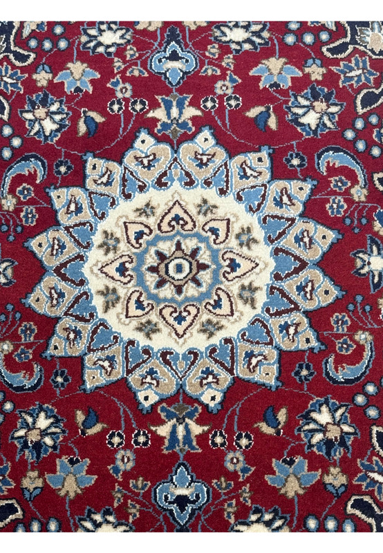 The 2'10" x 4'5" Red Persian Nain Rug laid down, showing the central medallion and symmetrical floral patterns.