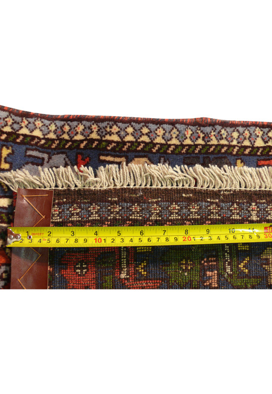 Zoomed into Ruler showing knot density on the back of a 2'8 x 6'3 Persian Yalameh Runner.