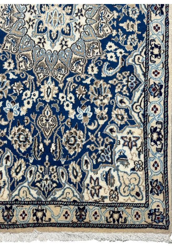 Edge view of the 3x5 Persian Nain Rug, showing the detailed border design and the fringe.