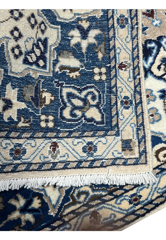 The backside of a 2'11 x 4'5 Persian Nain Rug, highlighting the precise knot work and craftsmanship.