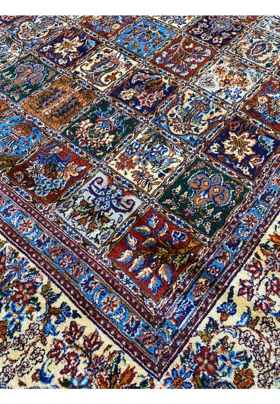 Zoomed-in pattern on the Persian Moud Rug displaying the vibrant colors and intricate craftsmanship.