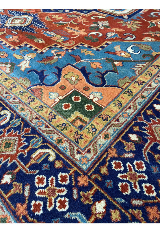 Angled close-up view of the 12' x 15' Oriental Serapi Rug showing the vibrant medallion