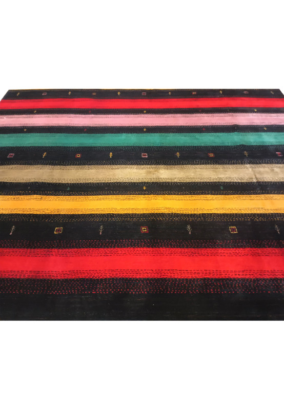 Upper part of 8'3" x 9'11" colorful Gabbeh rug with traditional motifs.