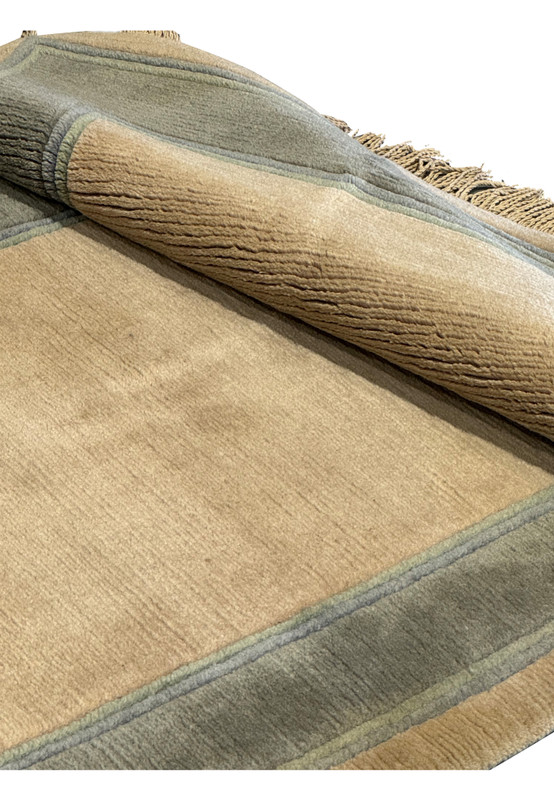 Rolled up view of 2'8" x 28' Nepali runner, easy storage and handling.