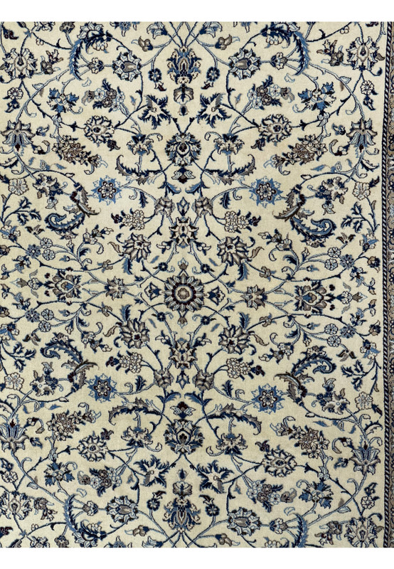 Close-up of the central floral design on the 8'2 x 11'6 Persian Nain rug.