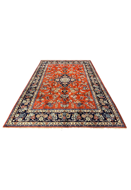 Laid down view of 6'6 x 10'2 Persian Sarough Rug displaying its detailed floral patterns and rich colors on a flat surface.