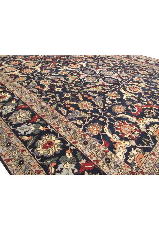 Close-up of the intricate floral and vine patterns on the midfield of the 15'9"x25' Oriental Ziglar rug.