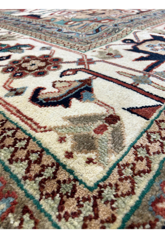 Detailed border of the 14 x 24 Beige Red Oriental Serapi Rug featuring floral and vine motifs.