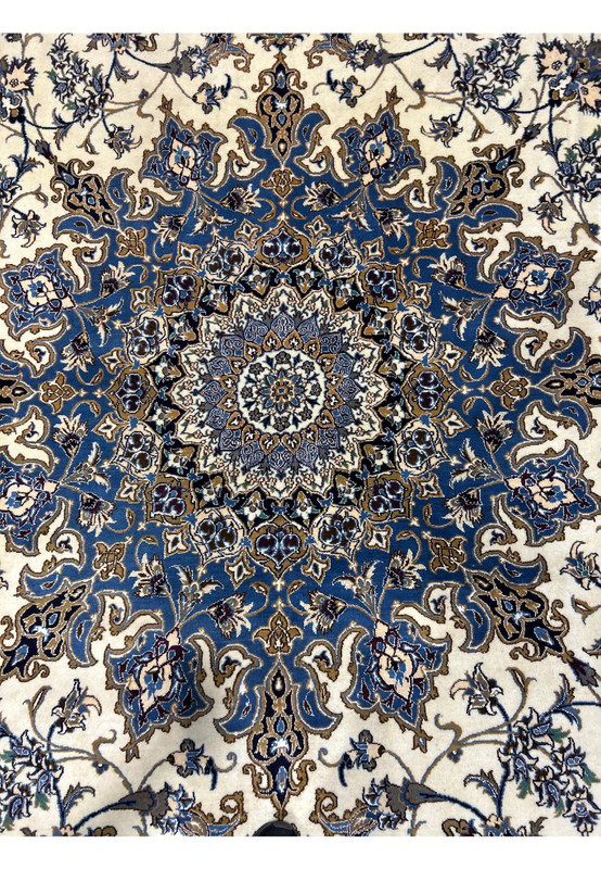 Medallion detail of the 16' x 16' Persian Nain rug showcasing fine hand-knotted work.