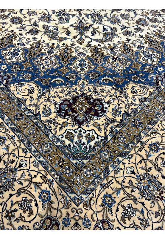 Detailed view of the border on the 16' x 16' Persian Nain rug with beige, navy, and taupe accents.