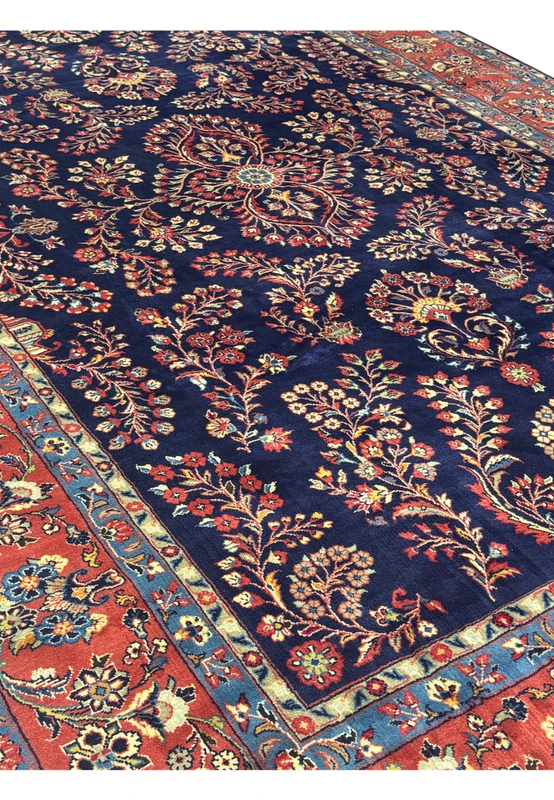 Angled view of Persian Sarough rug showing depth and intricate floral motifs.