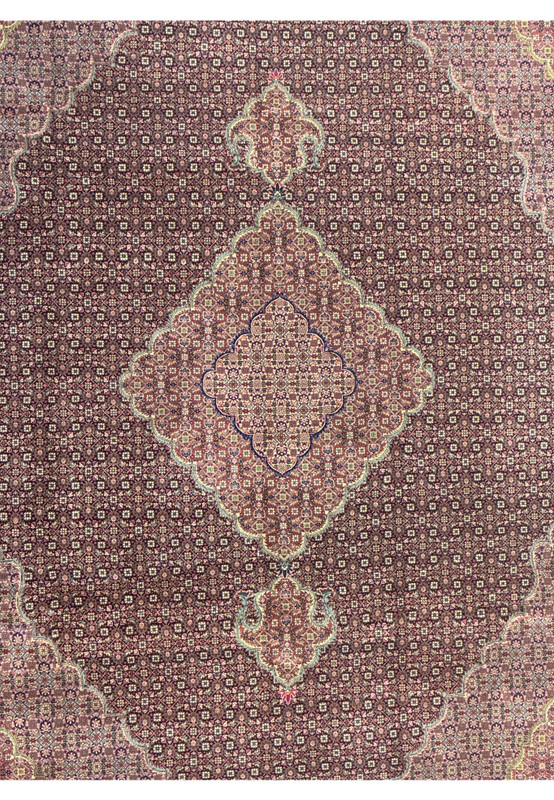 Detailed view of the central medallion of 8'3 x 11'3 Oriental Tabriz Rug, featuring geometric patterns and silk highlights.