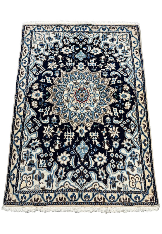 Hand-knotted 2'8 x 4'6 Persian Nain Rug with navy blue base and intricate floral medallion, bordered by light blue and ivory accents.