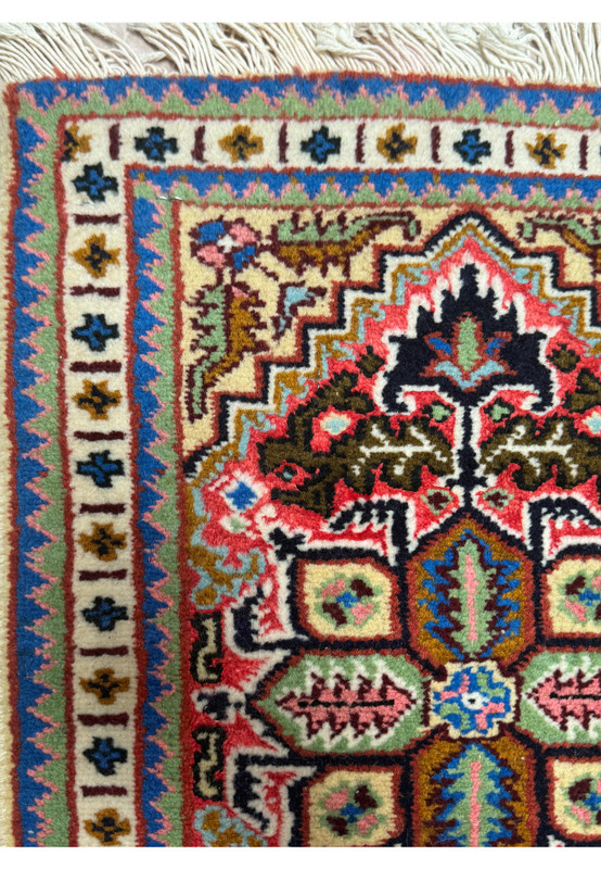 Detailed view of the geometric border on the 1'3 x 2 Ardebil Persian Wool & Silk Poshti Rug.