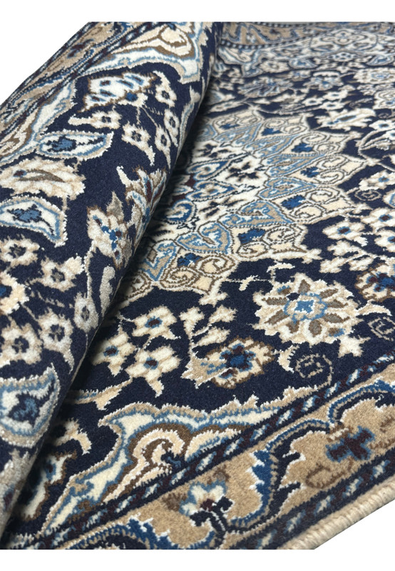 Rolled view of the 3'1 x 5 Persian Nain Rug highlighting wool texture and design.
