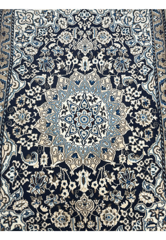 Close-up of medallion in 3'1 x 5 Persian Nain Rug with navy, beige, and blue accents