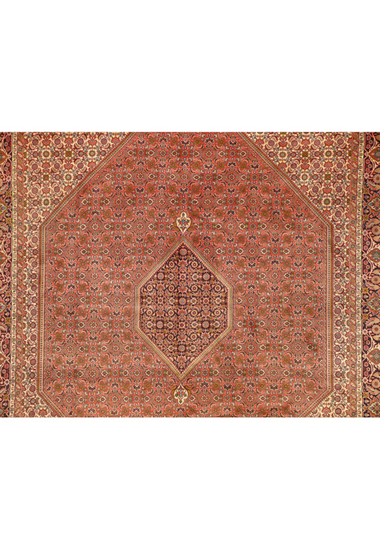 Central field of a handwoven Persian Bijar Rug, showcasing floral and geometric patterns in rust and navy.
