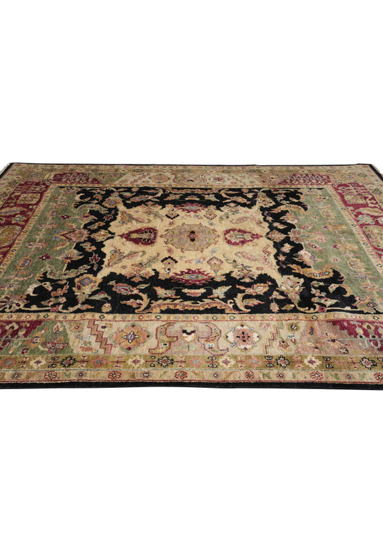 Side perspective of 8.5 x 11.6 Oushak rug featuring antique-inspired design with burgundy, green, and black wool accents.