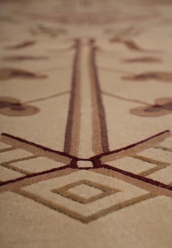 Zoomed design view showing abstract motifs and refined texture in wool and silk blend