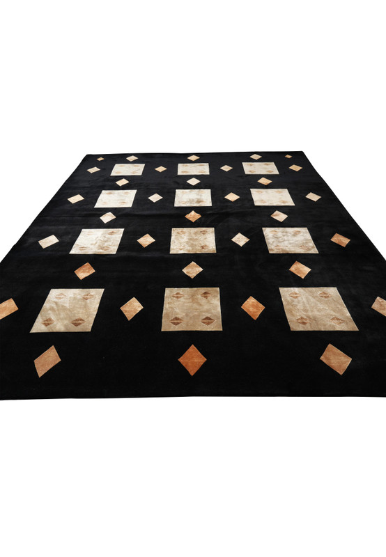 Angled view of 9 x 12 modern rug with subtle abstract pattern and soft sheen from silk highlights