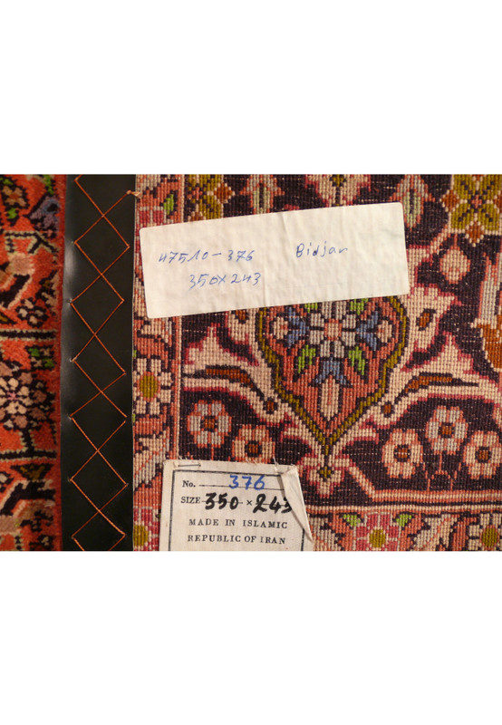 Tag with information confirming origin, size, and material of the 8 x 11'5 Persian Bijar rug.