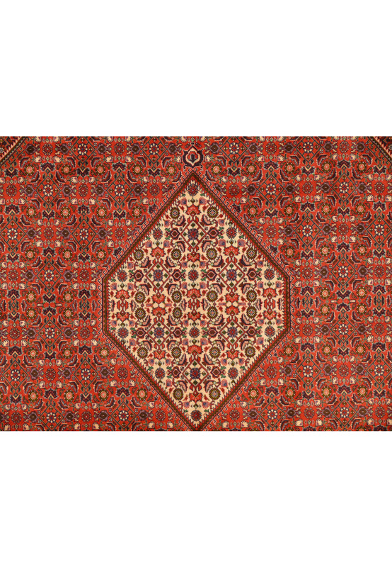 Close view of ivory diamond medallion and surrounding rust Herati field on 8'2 x 11'5 Bijar Persian rug.