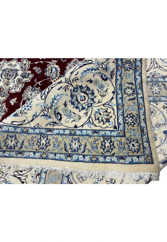 Detailed edge and backside of Persian Nain 9 LAA rug highlighting wool and silk craftsmanship