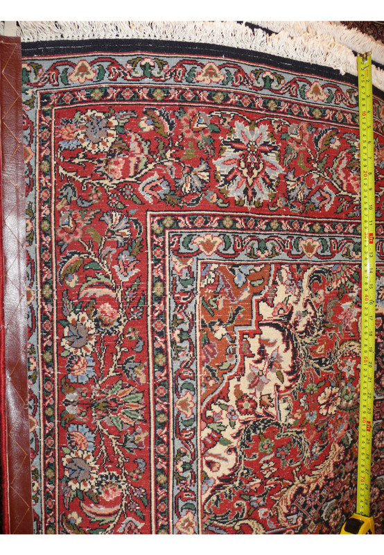 Backside with ruler showing dense hand-knotted weave of Persian Bijar rug