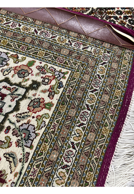 Backside of Tabriz 50 Raj Rug showing detailed hand-knotted weave and intricate floral motifs with precise knotting