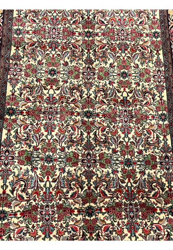 Close-up of allover floral field design on Persian Bijar Halvaie Rug