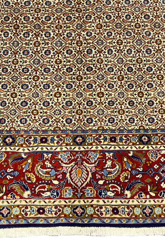 Lower border of Persian Moud rug with red, navy, and olive floral motifs