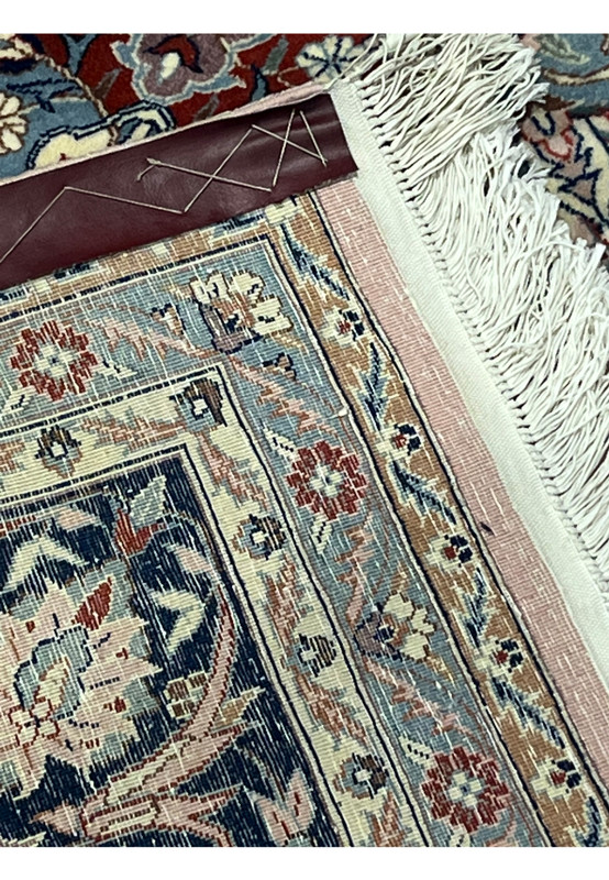 Backside close-up of Persian Tabriz rug showing fine hand-knotted weave and knot density