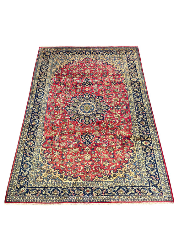 Laid-down perspective of the Persian Isfahan Rug highlighting intricate medallion details and rich red, navy, and ivory color tones.