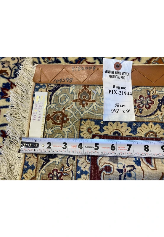 Close-up of the backside of the 9'6" x 9' Persian Nain 6La silk rug showing its fine knot density, original tag with rug number PIX-21944, ruler for scale, and handwoven wool-and-silk structure demonstrating authentic Persian craftsmanship and precision weaving.