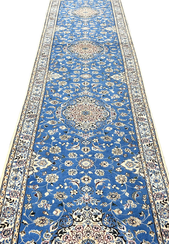 Low angle of Persian Nain 6LA Runner revealing shimmering silk details and medallion depth