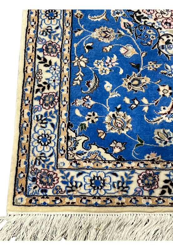 Ivory border with silk floral rosettes and vines on Persian Nain 6LA Runner, wool and silk texture visible.