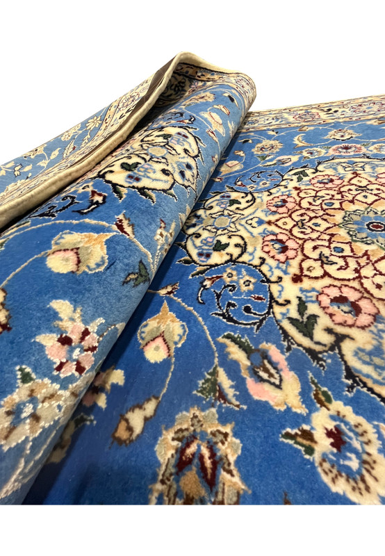 2'8 x 17'2 Blue Persian Nain 6LA Runner rolled to show royal-blue wool pile with off-white silk highlights and ivory border detail.