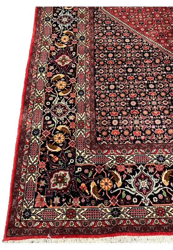 side border detail of 10x13 Bijar Persian Iron Rug showing floral scrollwork