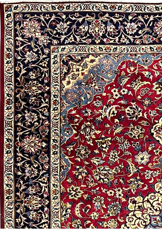 Border of 8'5 x 11'8 Persian Isfahan rug showing navy vines, ivory outlines, and detailed blossoms.