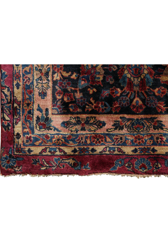 Close-up of original uneven fringes on antique Persian Kashan rug with soft wool pile and detailed floral corner border.
