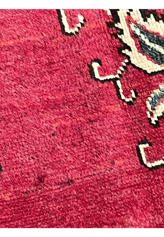 Documented worn spots on 10x13 vintage Persian Tabriz rug showing patina, thinning pile, and natural age-related wear in the red field.