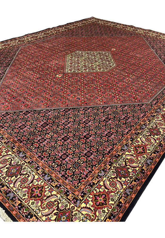 Angled perspective of rare size Persian Bijar iron rug emphasizing heavy wool structure, deep saturation, and architectural medallion layout