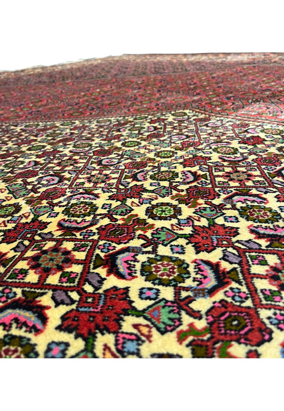 Pattern close up of Persian Bijar iron rug revealing compact floral geometry and bold traditional symmetry